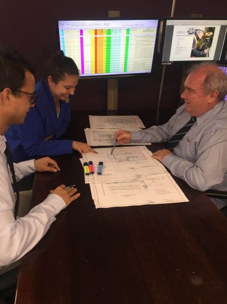 Super Valuations valuers reviewing strata plans and valuation data together